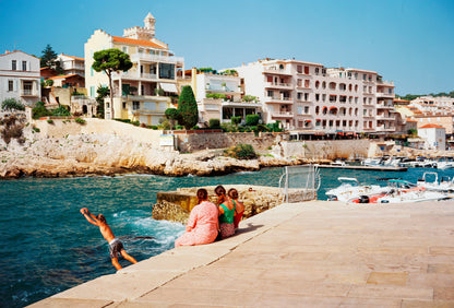 Girls chatting next to sea in Cassis, France